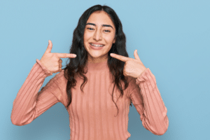 Teen smiling with braces for crooked teeth in Baton Rouge, LA