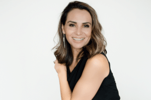 Adult woman smiling while wearing clear ceramic braces